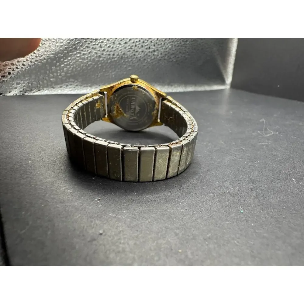 Dakota 3ATM WR Rock Solid Quartz Day/Date Watch Japan Stretch Band Gold Tone